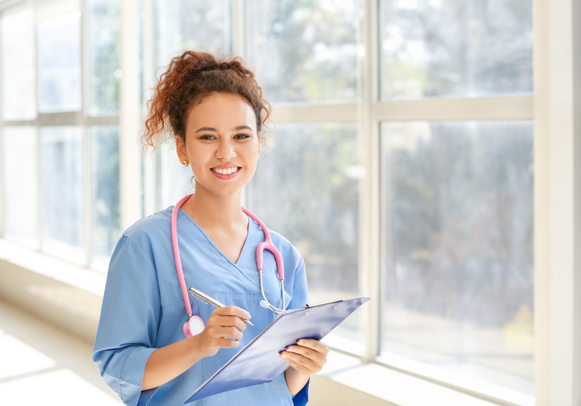 Young African-American nurse in clinic