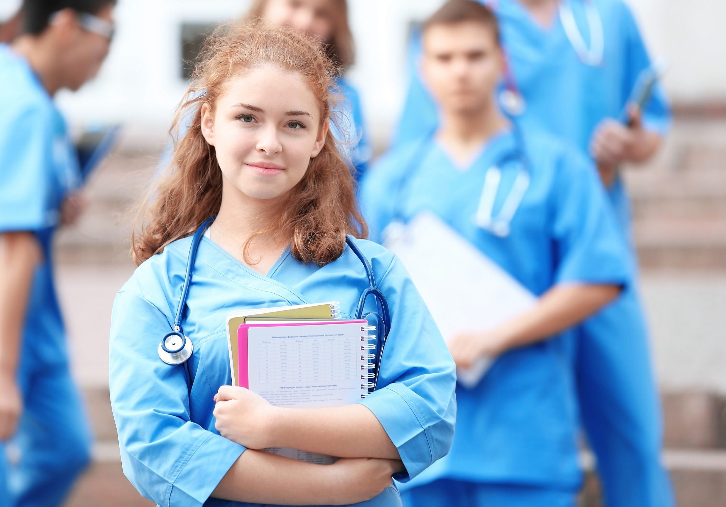 Young student with groupmates outdoors